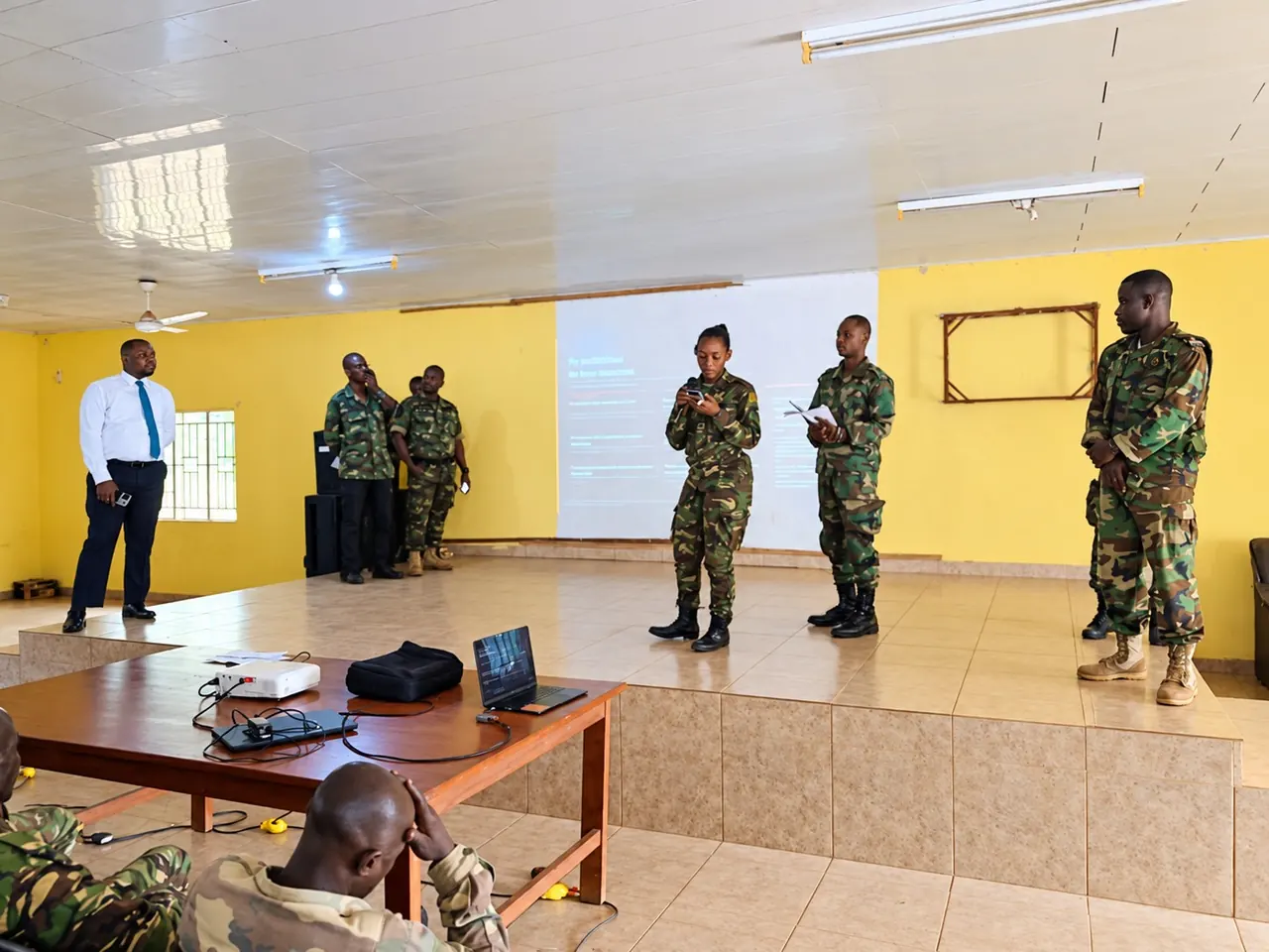 Participants in a training session with military personnel